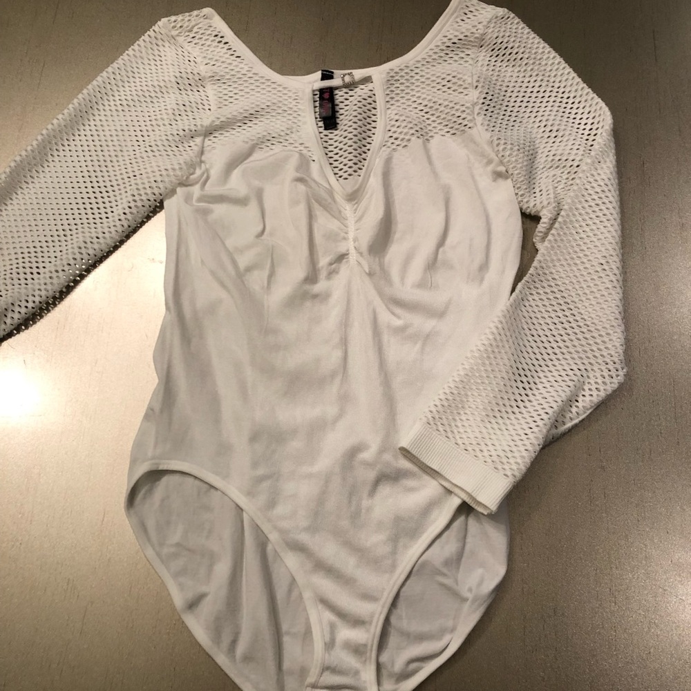 nylon body blouse small diamond in the front fishnet sleeves never been worn